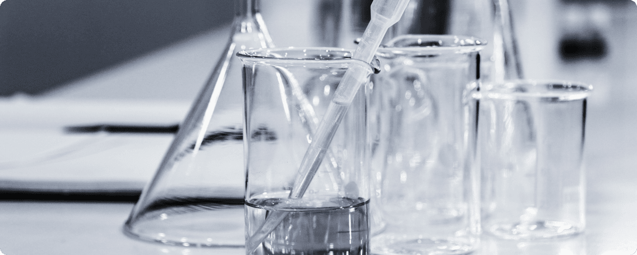 Laboratory equipment with glass beakers and testing apparatus